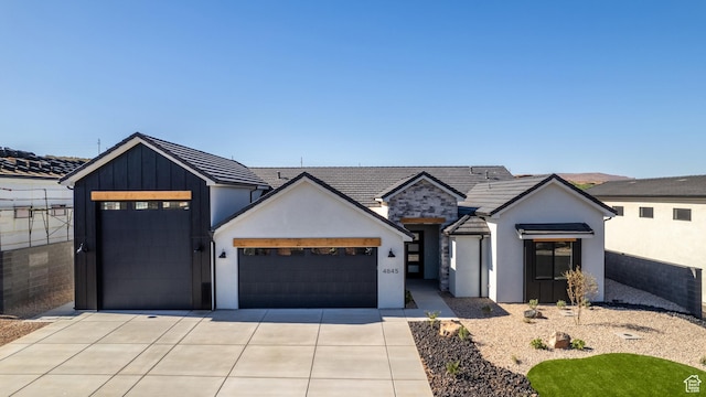 4845 W 2020 S, Hurricane, UT 84737 - modern inspired farmhouse with a garage, concrete driveway, stucco siding, board and batten siding, and a tiled roof