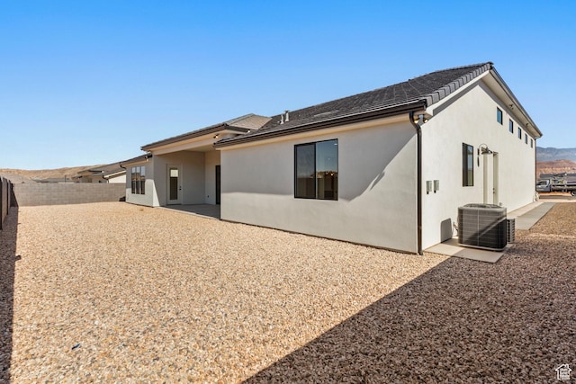 4845 W 2020 S, Hurricane, UT 84737 - back of property with a fenced backyard, central AC unit, stucco siding, and a patio