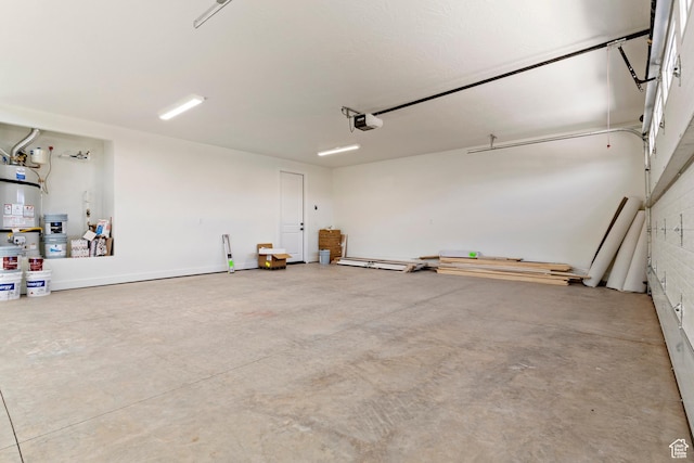 4845 W 2020 S, Hurricane, UT 84737 - garage featuring strapped water heater and a garage door opener