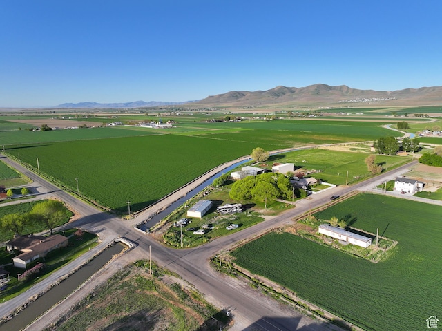 10045 W 12000 N, Bothwell, UT 84337 - aerial overview of property's location with rural landscape and mountains