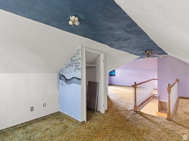 10045 W 12000 N, Bothwell, UT 84337 - bonus room featuring carpet flooring, vaulted ceiling, a textured ceiling, and a ceiling fan