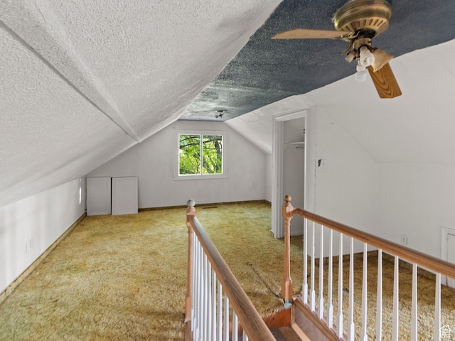 10045 W 12000 N, Bothwell, UT 84337 - additional living space featuring a ceiling fan, a textured ceiling, lofted ceiling, and carpet