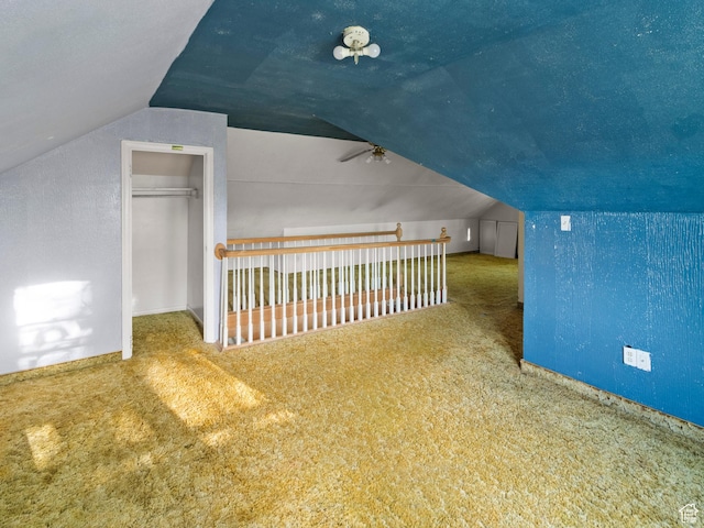 10045 W 12000 N, Bothwell, UT 84337 - additional living space featuring vaulted ceiling, ceiling fan, carpet flooring, and baseboards