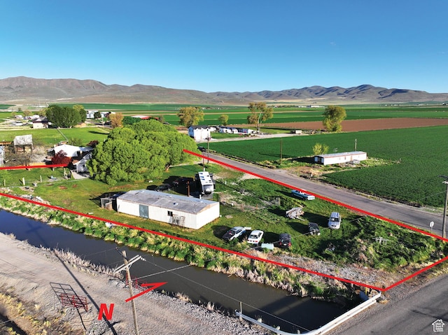 10045 W 12000 N, Bothwell, UT 84337 - aerial view of sparsely populated area with property parcel outlined and mountains