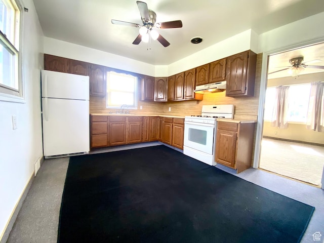 271 S Court St W, Soda Springs, ID 83276 - kitchen with white appliances, under cabinet range hood, a ceiling fan, and light countertops
