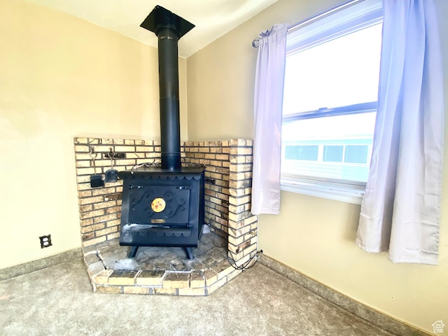 271 S Court St W, Soda Springs, ID 83276 - detailed view of a wood stove, carpet, and baseboards