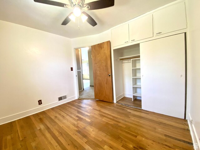 271 S Court St W, Soda Springs, ID 83276 - unfurnished bedroom featuring wood finished floors, a closet, baseboards, and a ceiling fan