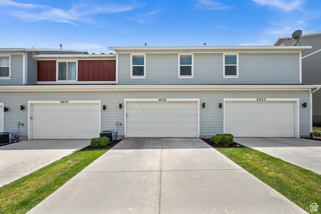 6616 W 7735 S, West Jordan, UT 84081 - view of property featuring a garage and concrete driveway
