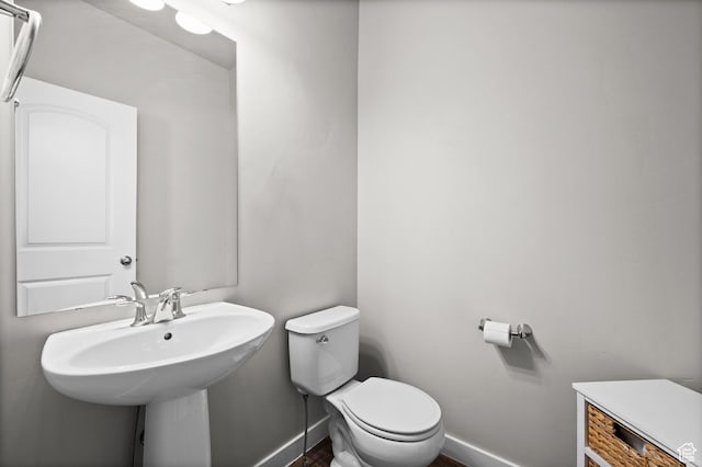 6616 W 7735 S, West Jordan, UT 84081 - bathroom with toilet, baseboards, and a sink