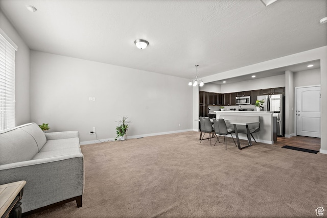 6616 W 7735 S, West Jordan, UT 84081 - living room featuring light colored carpet, baseboards, and recessed lighting