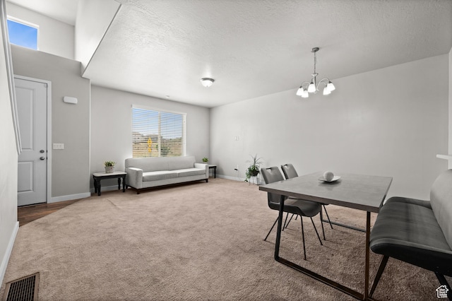6616 W 7735 S, West Jordan, UT 84081 - carpeted dining space with a chandelier, baseboards, a textured ceiling, and plenty of natural light