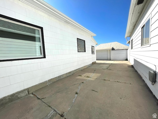 view of property exterior featuring a detached garage