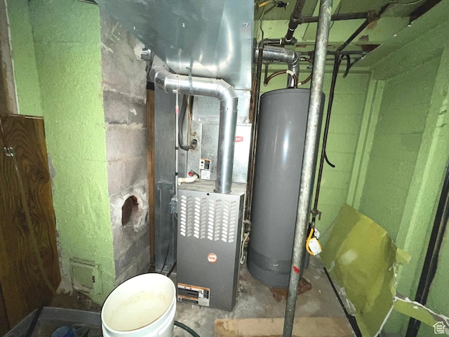 utility room featuring water heater