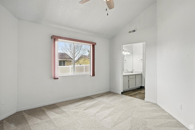 710 W 1350 S, Cedar City, UT 84720 - unfurnished bedroom with carpet flooring, lofted ceiling, ensuite bath, baseboards, and a ceiling fan