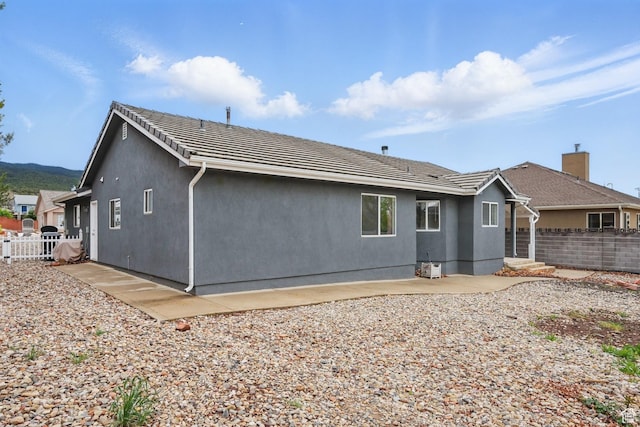 710 W 1350 S, Cedar City, UT 84720 - rear view of house featuring fence, stucco siding, and a patio
