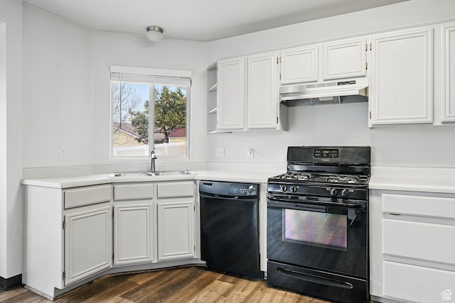 710 W 1350 S, Cedar City, UT 84720 - kitchen featuring black appliances, under cabinet range hood, a sink, light countertops, and wood finished floors