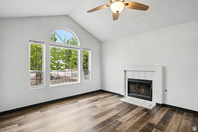 710 W 1350 S, Cedar City, UT 84720 - unfurnished living room featuring lofted ceiling, ceiling fan, wood finished floors, a tiled fireplace, and baseboards