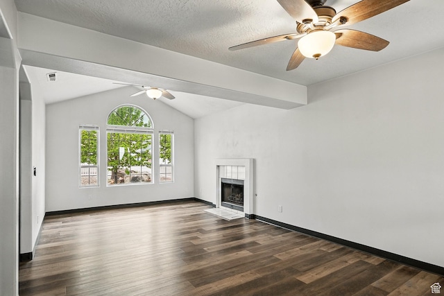 710 W 1350 S, Cedar City, UT 84720 - unfurnished living room featuring ceiling fan, dark wood-type flooring, a tile fireplace, lofted ceiling, and baseboards