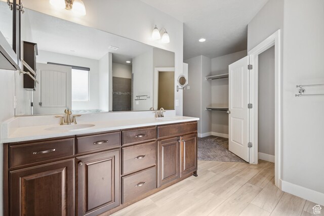 3335 W 2570 S, Hurricane, UT 84737 - full bath featuring double vanity, wood finished floors, and baseboards