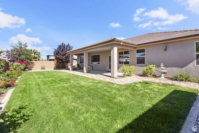 3335 W 2570 S, Hurricane, UT 84737 - rear view of house with a patio, stucco siding, and a tiled roof