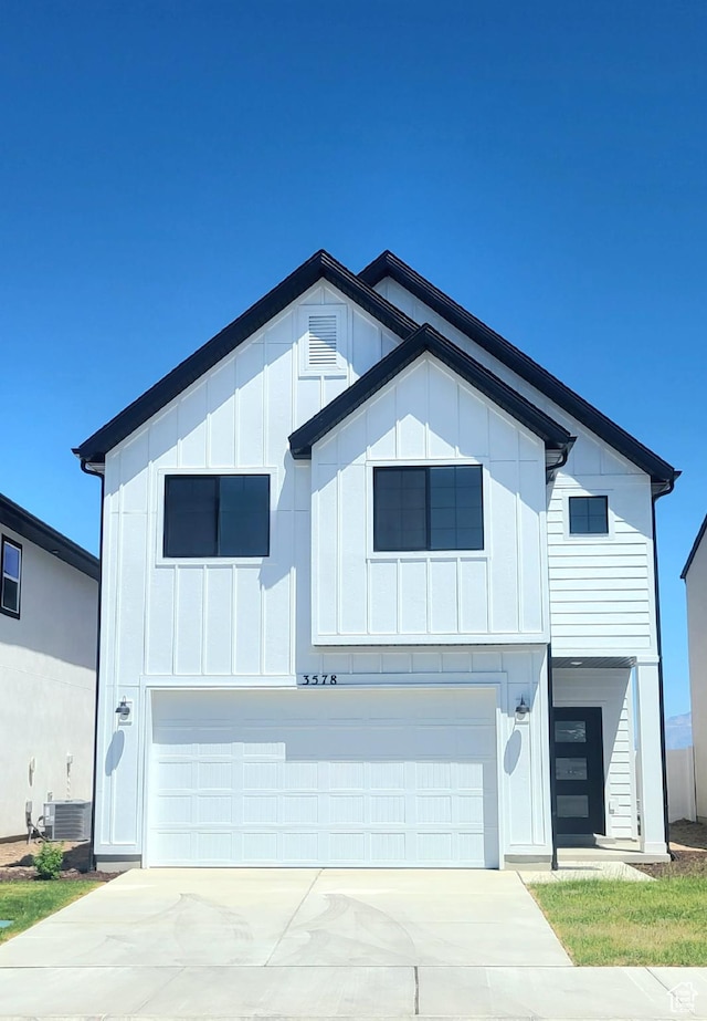 3578 W 4835 S Lot 13, Roy, UT 84067 - view of front facade with a garage, board and batten siding, driveway, and central AC unit