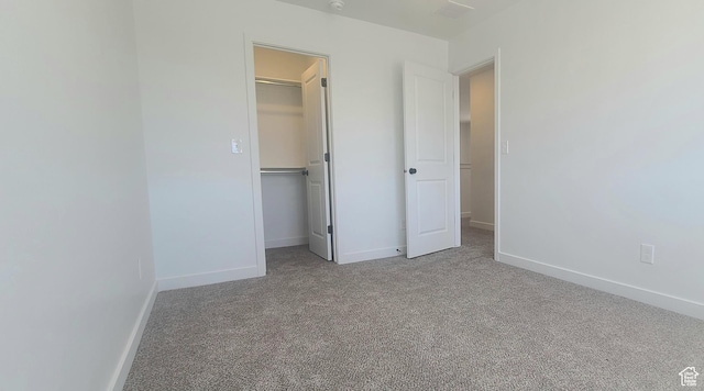 3578 W 4835 S Lot 13, Roy, UT 84067 - unfurnished bedroom with a walk in closet, carpet, a closet, and baseboards