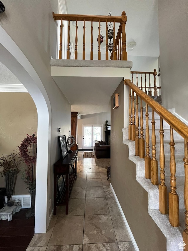 4863 Glasmann Way, Ogden, UT 84403 - staircase with arched walkways and baseboards