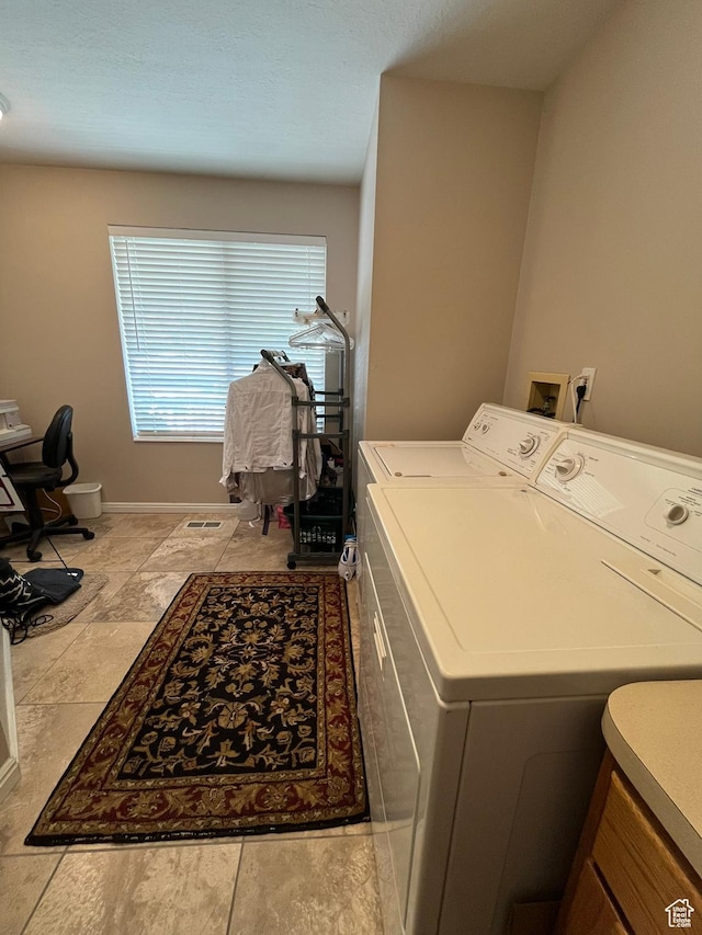 4863 Glasmann Way, Ogden, UT 84403 - laundry room featuring separate washer and dryer and baseboards