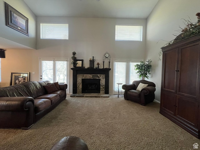 4863 Glasmann Way, Ogden, UT 84403 - carpeted living room with a towering ceiling, a stone fireplace, and plenty of natural light