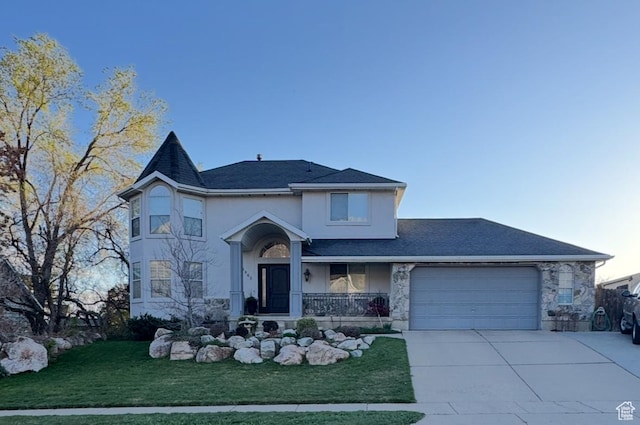 4863 Glasmann Way, Ogden, UT 84403 - view of front of property with an attached garage, stucco siding, concrete driveway, a front yard, and stone siding