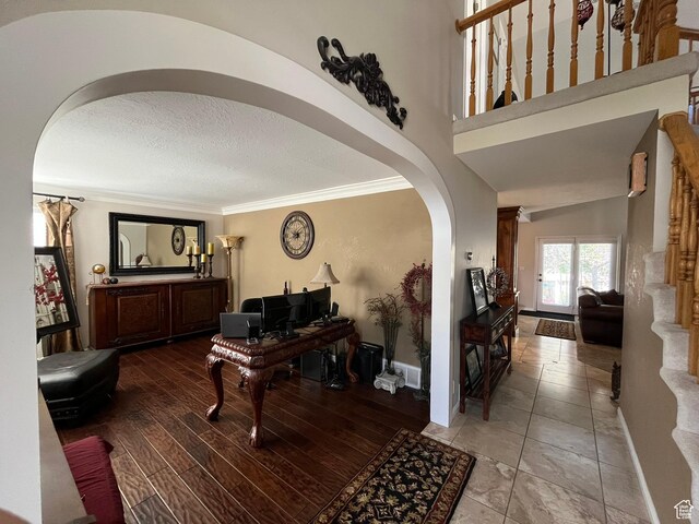 4863 Glasmann Way, Ogden, UT 84403 - entrance foyer featuring arched walkways, ornamental molding, baseboards, and a textured ceiling