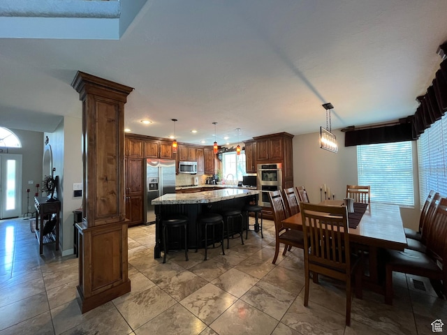 4863 Glasmann Way, Ogden, UT 84403 - dining area featuring decorative columns