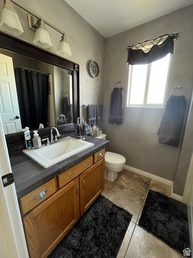 4863 Glasmann Way, Ogden, UT 84403 - full bathroom with toilet, vanity, baseboards, and a shower with shower curtain