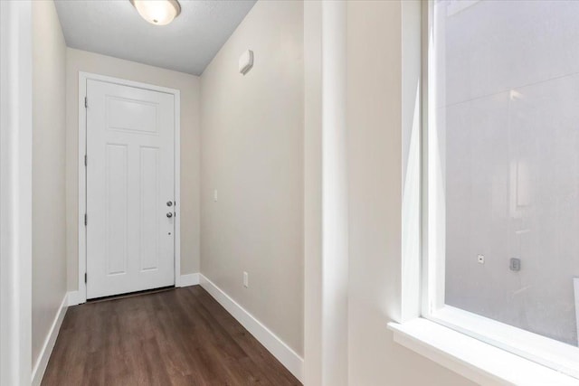 5621 W Stillwell Ln S, Herriman, UT 84096 - entryway featuring baseboards and dark wood-style flooring
