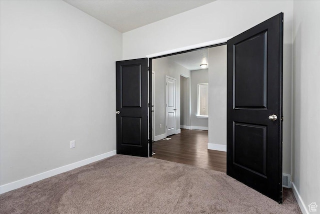 5621 W Stillwell Ln S, Herriman, UT 84096 - unfurnished bedroom with dark colored carpet and baseboards