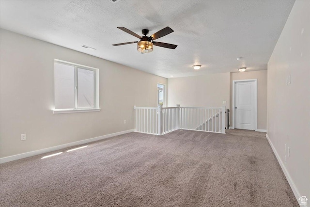 5621 W Stillwell Ln S, Herriman, UT 84096 - carpeted spare room with a textured ceiling, a ceiling fan, and baseboards