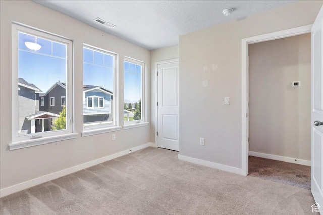 5621 W Stillwell Ln S, Herriman, UT 84096 - unfurnished room with carpet floors, baseboards, and a smoke detector