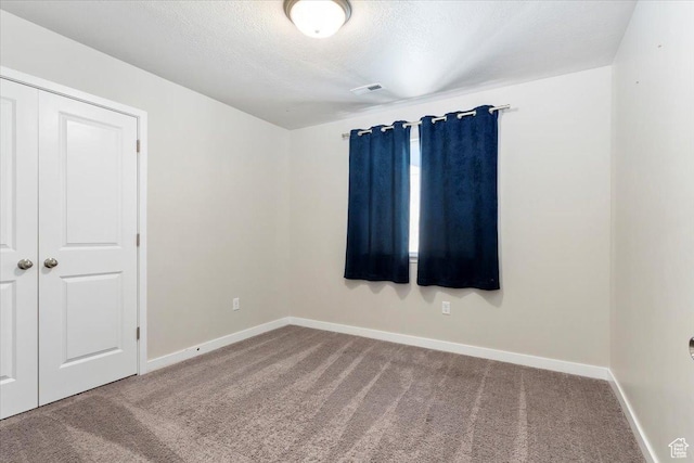 5621 W Stillwell Ln S, Herriman, UT 84096 - unfurnished room featuring carpet flooring, baseboards, and a textured ceiling