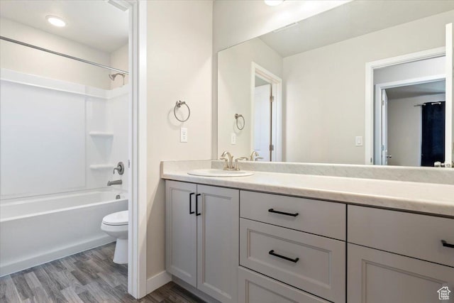 5621 W Stillwell Ln S, Herriman, UT 84096 - full bath featuring toilet, vanity, wood finished floors, shower / washtub combination, and baseboards