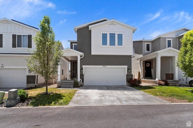 5621 W Stillwell Ln S, Herriman, UT 84096 - view of front of property with stucco siding, a garage, and concrete driveway