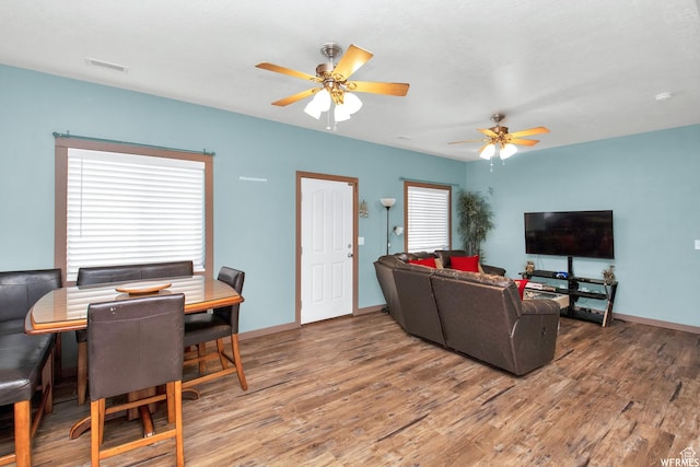 855 W 350 N, Tremonton, UT 84337 - living room featuring light wood-style flooring, a ceiling fan, and baseboards