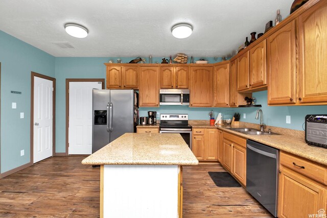 855 W 350 N, Tremonton, UT 84337 - kitchen featuring appliances with stainless steel finishes, a sink, a center island, and dark wood-style floors