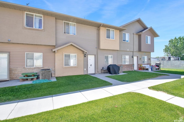 855 W 350 N, Tremonton, UT 84337 - back of house featuring a patio, stucco siding, and central AC unit