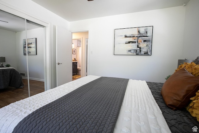 604 E 3635 S, Salt Lake City, UT 84106 - bedroom featuring wood finished floors, a closet, and baseboards