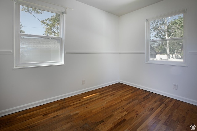 604 E 3635 S, Salt Lake City, UT 84106 - unfurnished room with dark wood-style flooring, baseboards, and plenty of natural light