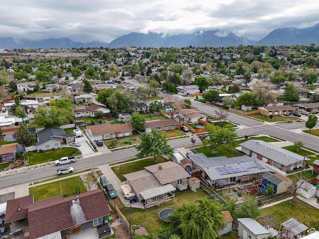 aerial view of residential area featuring mountains