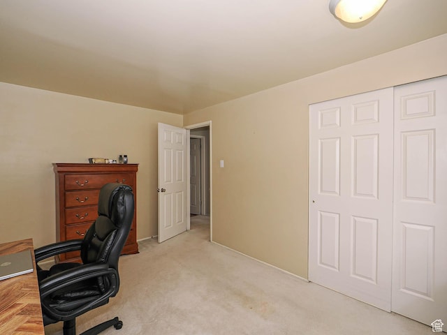 office with light carpet and baseboards