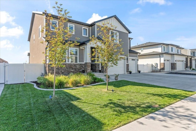 2102 S 2200 W, Woods Cross, UT 84087 - view of front of house with board and batten siding, concrete driveway, stone siding, a gate, and an attached garage