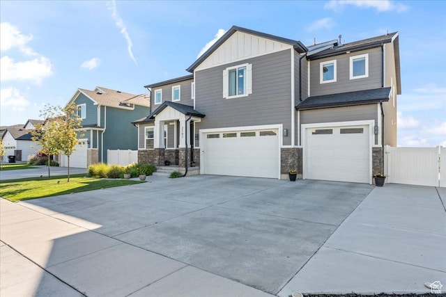 2102 S 2200 W, Woods Cross, UT 84087 - craftsman-style house featuring board and batten siding, a garage, stone siding, and concrete driveway
