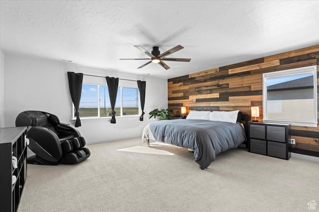 2102 S 2200 W, Woods Cross, UT 84087 - bedroom with wooden walls, carpet flooring, a textured ceiling, and a ceiling fan